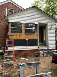 Wall framing and window: Before: siding removed
