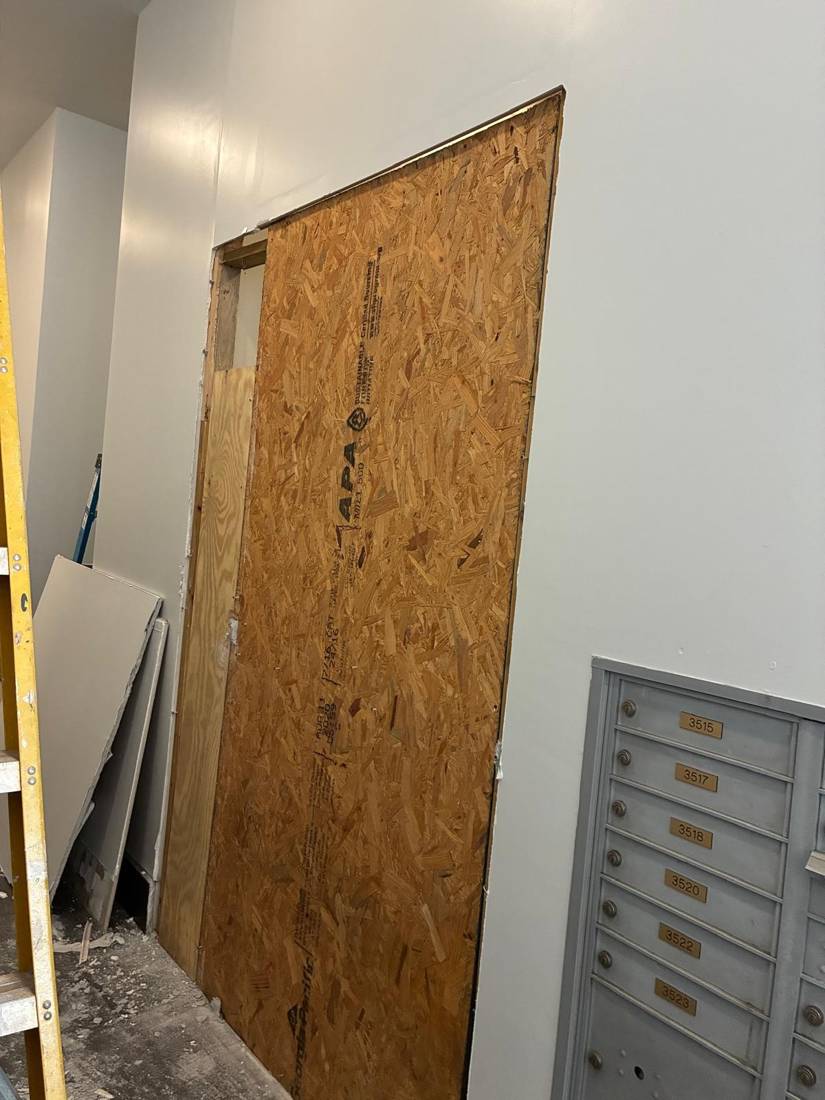 Wall opening patch: Before: opening boarded